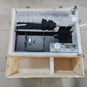 A3 DTF L18050 Printer with Module โ Powerful & Compact DTF Printing Machine | ProlificGeeks - DTF printer accessories, maintenance tools, ink bottles, roll feeder components, and USB dongle organized in a foam-lined wooden crate.