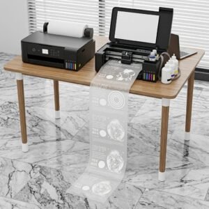 A3 DTF L18050 Printer with Module โ Powerful & Compact DTF Printing Machine | ProlificGeeks - DTF transfer printer actively printing a long continuous roll of white ink designs onto PET film onto the tiled floor in a workshop setting.